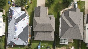 Grey roof tiles being installed by professional roofers in Katy, TX.