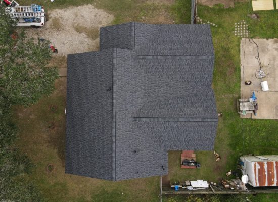 A well-maintained grey residential roof in Katy, TX